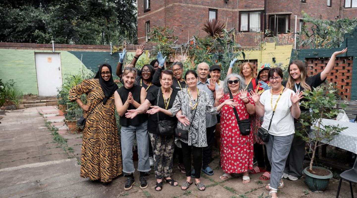 image: a group of residents smiling while posing for a photo as part of the G15 “Room to Grow” report launch
