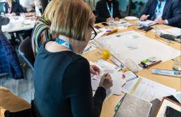 Involved resident writes on a piece of paper