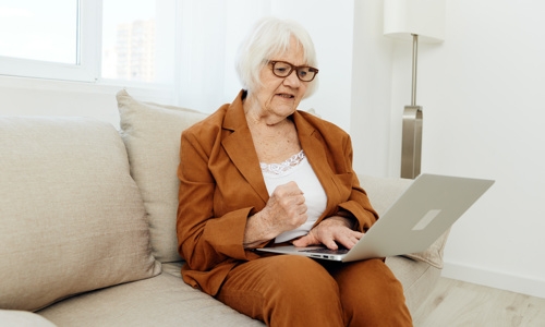 Woman On Laptop At Home