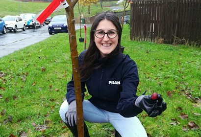 F Dita Pilon Crouching By Planted Tree