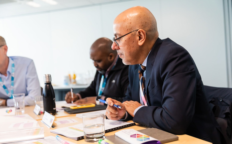 Puneet Rajput, Director of Governance and Regulation, takes part in a resident Board meeting