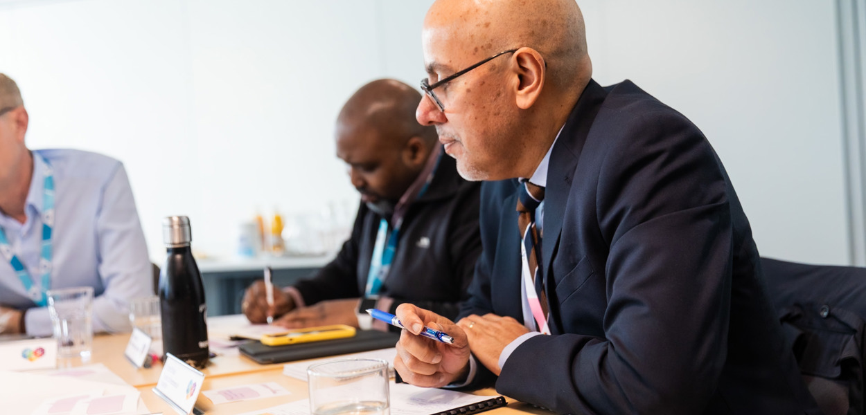 Puneet Rajput, Director of Governance and Regulation, takes part in a resident Board meeting