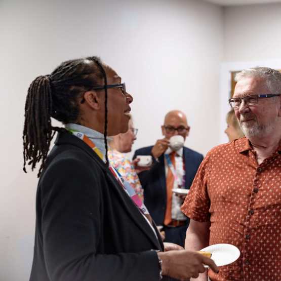 Dave Burton, Chair of the Scrutiny Panel, speaks to Geanna Bray, Board Member Responsible for Complaints