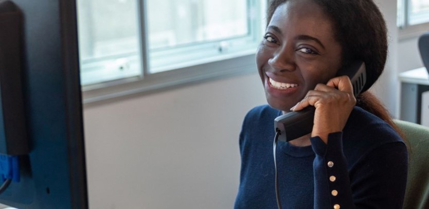 image: a member of the Southern Housing customer services team answering the phone