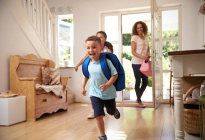 Boy running into house 