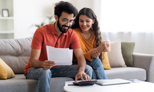 Couple On Laptop At Home